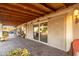 Covered patio with roll-down shades, beautiful brick pavers, offering a seamless indoor-outdoor living experience at 11138 W Hatcher Rd, Sun City, AZ 85351