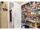 Organized pantry showcases an abundance of shelving for maximum storage capacity at 11138 W Hatcher Rd, Sun City, AZ 85351