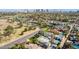 Expansive aerial view of a neighborhood with mature trees and desert landscaping at 1129 W Holly St, Phoenix, AZ 85007