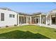 A well-manicured backyard patio with a large grassy area at 1129 W Holly St, Phoenix, AZ 85007