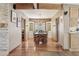 Open dining room featuring beautiful wood floors and bright, picturesque window features at 1129 W Holly St, Phoenix, AZ 85007