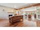 Inviting living room featuring a fireplace, wood floors, and views into other rooms at 1129 W Holly St, Phoenix, AZ 85007