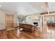 Cozy living room with hardwood floors, stone fireplace, and wood beams at 1129 W Holly St, Phoenix, AZ 85007