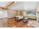 Spacious living room with hardwood floors and a stone fireplace at 1129 W Holly St, Phoenix, AZ 85007