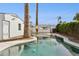 Backyard pool area with palm trees and patio at 1129 W Holly St, Phoenix, AZ 85007