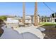 A backyard swimming pool with palm trees and umbrella at 1129 W Holly St, Phoenix, AZ 85007