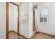 The walk-in shower features decorative tile, glass door, and a window that brings in plenty of natural light at 1129 W Holly St, Phoenix, AZ 85007