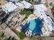 A high angle aerial view of a community pool featuring an irregular shape and a well kept surrounding amenity area at 11451 S Half Moon Dr, Phoenix, AZ 85044