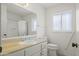 Clean bathroom featuring a vanity sink, toilet, and shower at 11451 S Half Moon Dr, Phoenix, AZ 85044