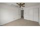 Bedroom featuring neutral walls, plush carpeting, a window, and closet at 11451 S Half Moon Dr, Phoenix, AZ 85044