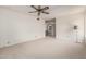 Large bedroom with windows allowing for natural light and neutral carpeting at 11451 S Half Moon Dr, Phoenix, AZ 85044