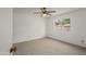 Bright bedroom with plush carpeting, neutral walls, and a window at 11451 S Half Moon Dr, Phoenix, AZ 85044