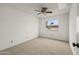 Cozy bedroom featuring neutral walls, plush carpeting, and a window at 11451 S Half Moon Dr, Phoenix, AZ 85044