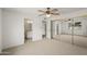 Bedroom featuring plush carpeting, a closet, and an attached bathroom at 11451 S Half Moon Dr, Phoenix, AZ 85044