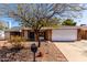 Charming single-story home featuring a two-car garage, brick accents, and a well-maintained desert landscaped front yard at 11451 S Half Moon Dr, Phoenix, AZ 85044