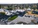 A view of the community's recreation center, featuring a courtyard, tennis courts, and beautifully manicured landscaping at 11451 S Half Moon Dr, Phoenix, AZ 85044