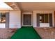 Charming front entrance featuring a gray door and well-maintained landscaping at 11451 S Half Moon Dr, Phoenix, AZ 85044