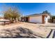 Charming single-story home featuring a two-car garage, brick accents, and low-maintenance desert landscaping at 11451 S Half Moon Dr, Phoenix, AZ 85044