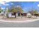 Attractive single-Gathering home featuring mature trees, a two-car garage, and a well-kept front yard at 11451 S Half Moon Dr, Phoenix, AZ 85044