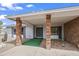 Cozy front porch with brick columns, providing a welcoming entrance to the home at 11451 S Half Moon Dr, Phoenix, AZ 85044