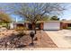 Charming single-story home featuring a two-car garage, brick accents, and a well-maintained desert landscaped front yard at 11451 S Half Moon Dr, Phoenix, AZ 85044