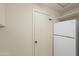 Laundry room has lots of storage with a full sized refrigerator at 11451 S Half Moon Dr, Phoenix, AZ 85044