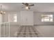 Spacious living room with neutral carpet and stylish tile accents at the entrance at 11451 S Half Moon Dr, Phoenix, AZ 85044