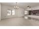 Inviting living room with a decorative chandelier and views into the adjacent room at 11451 S Half Moon Dr, Phoenix, AZ 85044