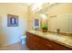 Bathroom with granite countertops, double sinks, and custom wood cabinetry at 11640 N Tatum Blvd # 3074, Phoenix, AZ 85028