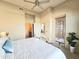 Comfortable bedroom with a ceiling fan, access to balcony and ensuite bathroom at 11640 N Tatum Blvd # 3074, Phoenix, AZ 85028