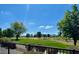 View of the lush green golf course surrounded by trees, as seen from the backyard at 11640 N Tatum Blvd # 3074, Phoenix, AZ 85028