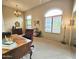 Home office featuring a traditional desk, large windows and a comfortable work environment at 11640 N Tatum Blvd # 3074, Phoenix, AZ 85028