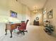 Spacious home office with chandelier, classic decor, and ample natural light at 11640 N Tatum Blvd # 3074, Phoenix, AZ 85028