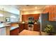 Spacious kitchen with stainless steel appliances, granite countertops, and wood cabinetry at 11640 N Tatum Blvd # 3074, Phoenix, AZ 85028