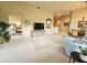 Open living area with views to bedroom and dining room, featuring a comfortable seating arrangement at 11640 N Tatum Blvd # 3074, Phoenix, AZ 85028