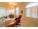 Office with chandelier, arched windows and wooden desk at 11640 N Tatum Blvd # 3074, Phoenix, AZ 85028