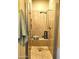 Modern shower with glass door, stone flooring, and convenient showerhead at 11640 N Tatum Blvd # 3074, Phoenix, AZ 85028