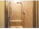 Shower with tiled walls, glass door, and a built-in bench at 11640 N Tatum Blvd # 3074, Phoenix, AZ 85028