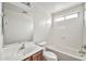 Bathroom featuring a single sink vanity and tub-shower combination at 11765 W Maui Ln, El Mirage, AZ 85335