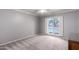 Bedroom featuring neutral carpet, a window, and ceiling fan at 120 E Calavar Rd, Phoenix, AZ 85022