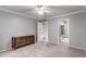 Bedroom featuring neutral carpet, ceiling fan, and closet at 120 E Calavar Rd, Phoenix, AZ 85022