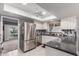 Bright kitchen with stainless steel refrigerator and a view to another room at 120 E Calavar Rd, Phoenix, AZ 85022