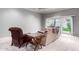 Bright living room with gray walls, a sliding glass door, and comfortable seating at 120 E Calavar Rd, Phoenix, AZ 85022