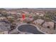 Aerial view of the home showcasing the surrounding neighborhood and cul-de-sac location at 12231 S 185Th Ave, Goodyear, AZ 85338