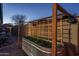 Backyard gardening area with a raised garden bed and a custom-built trellis for climbing plants at 12231 S 185Th Ave, Goodyear, AZ 85338