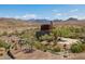 Desert community featuring a community building, a water feature, and desert landscaping at 12231 S 185Th Ave, Goodyear, AZ 85338