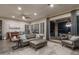 Elegant living room featuring hardwood floors, stylish furnishings, and access to the outdoor patio at 12231 S 185Th Ave, Goodyear, AZ 85338