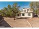 Expansive backyard with mature trees, providing ample space for recreation and outdoor activities at 12509 W Whyman St, Avondale, AZ 85323