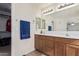 Bathroom featuring a double vanity, tile flooring, and neutral walls at 12509 W Whyman St, Avondale, AZ 85323