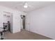 Bedroom featuring carpeted floors, a closet, and a doorway leading into another room at 12509 W Whyman St, Avondale, AZ 85323